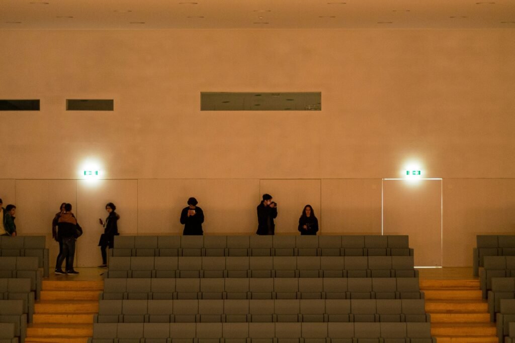 a group of people standing next to each other in a room