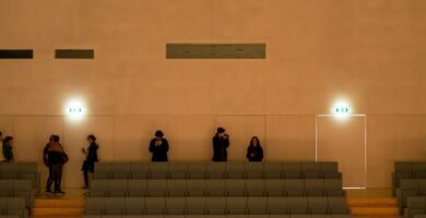 a group of people standing next to each other in a room