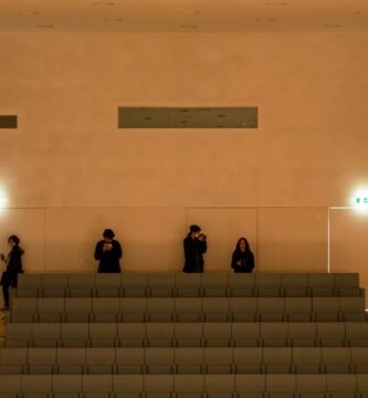 a group of people standing next to each other in a room